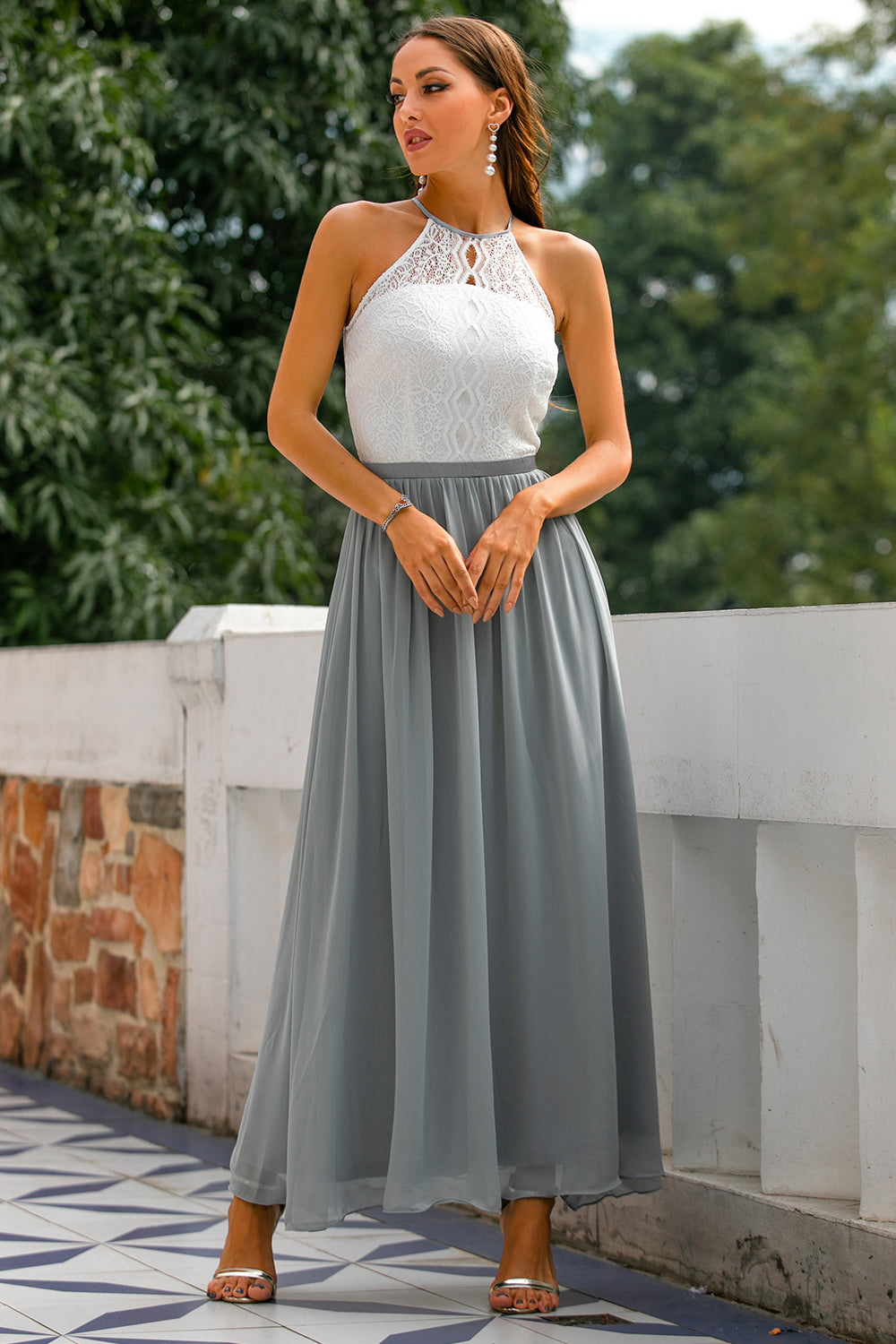 Halter neck maxi dress in a rich jewel tone, a stunning option for a wedding guest outfit.