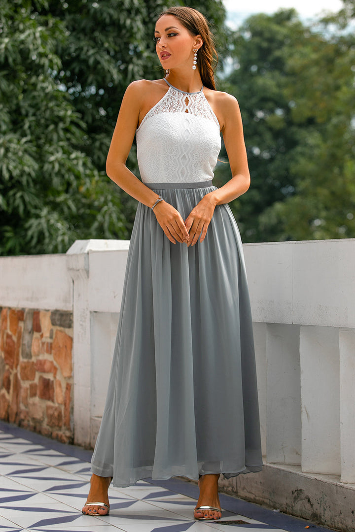Halter neck maxi dress in a rich jewel tone, a stunning option for a wedding guest outfit.