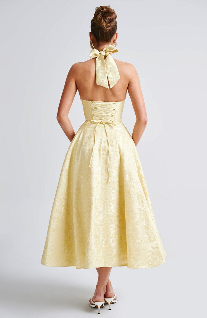 Elegant women's midi dress with a flattering halter neckline, perfect for sophisticated events