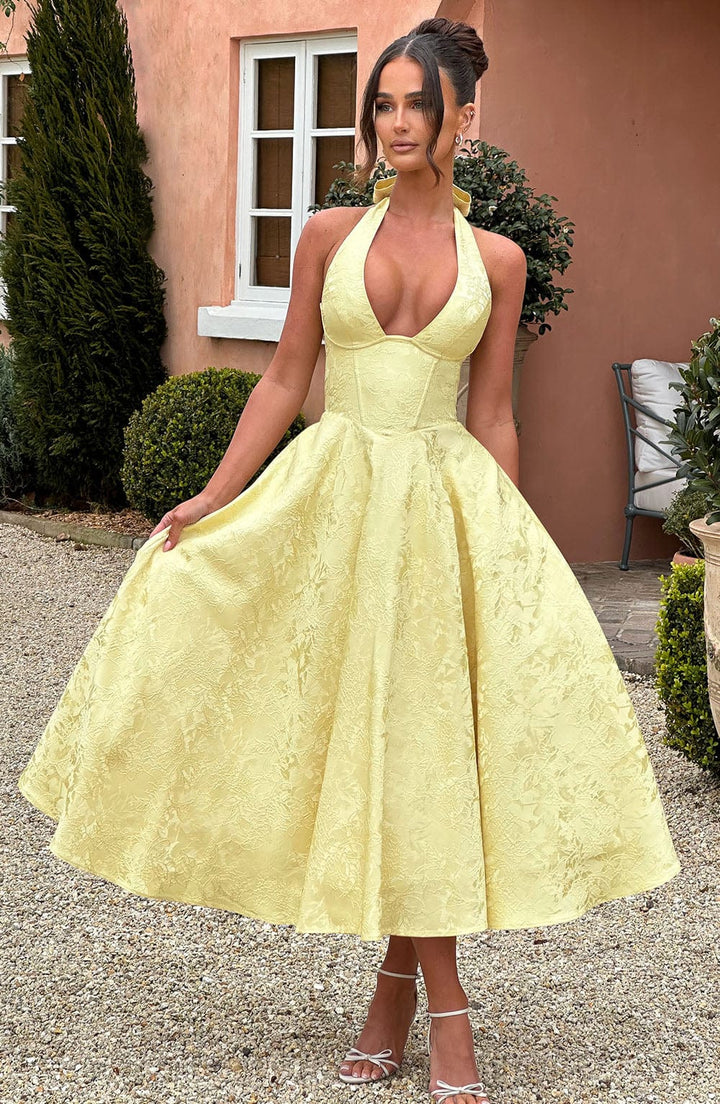 Stunning women's party wear: a halter neck midi dress radiating elegance and style