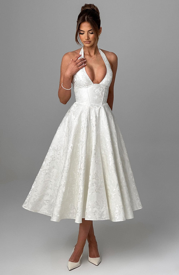 Graceful event wear: a women's halter neck midi dress in a vibrant color, elegant and flattering