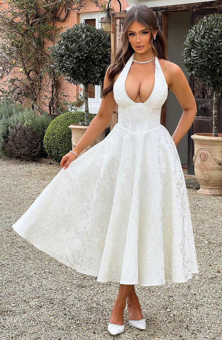Fashionable summer dress: women's halter neck midi with elegant drape, perfect for warm evenings