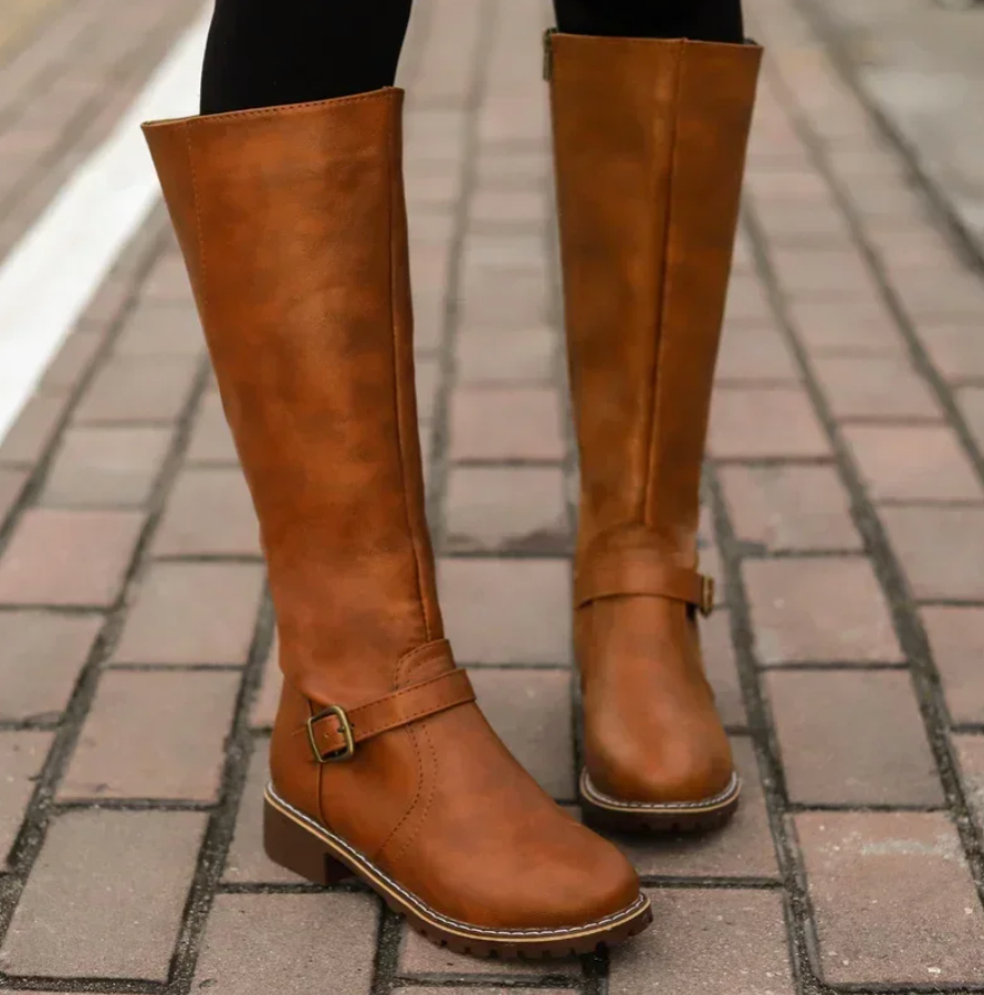 Stylish black knee-high leather boots for women, a versatile winter footwear choice