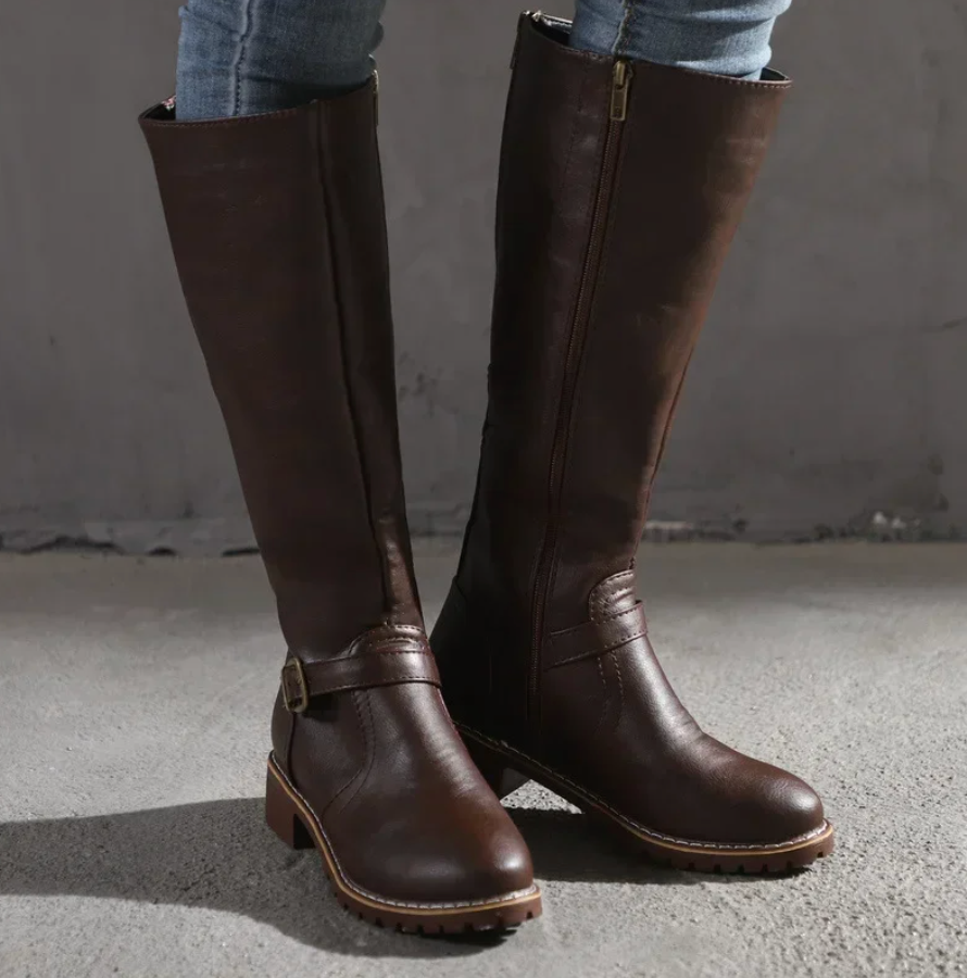 Fashionable women's brown knee-high boots with a sleek design, suitable for elegant outfits