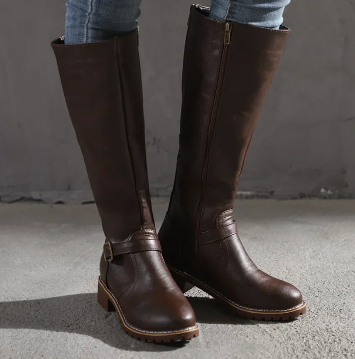 Fashionable women's brown knee-high boots with a sleek design, suitable for elegant outfits