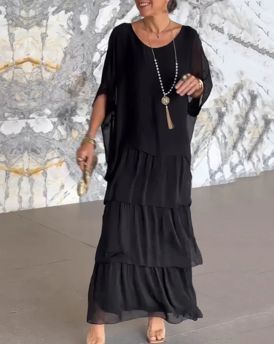 Layered maxi dress for women, elegant and flowy A-line cut, perfect for a bohemian chic look.