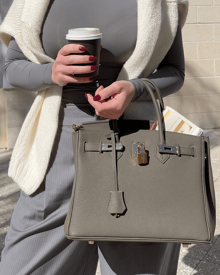 Stylish black leather women's handbag. Premium quality elegant purse, a versatile fashion accessory.