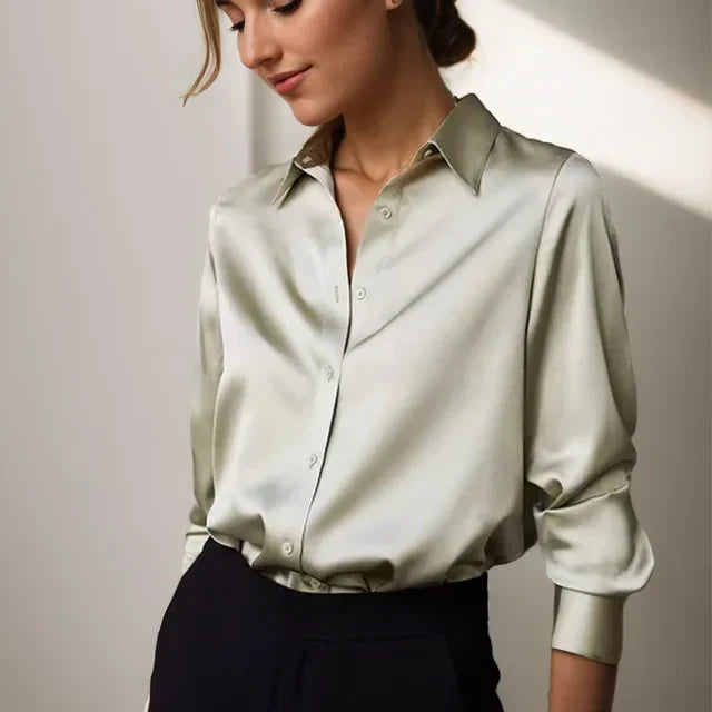Elegant women's long sleeve button-down blouse. Versatile for office wear or casual chic fashion. Classic style.
