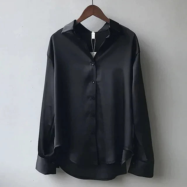 Classic black women's long sleeve button-down blouse. Comfortable & elegant, ideal for office and casual wear.