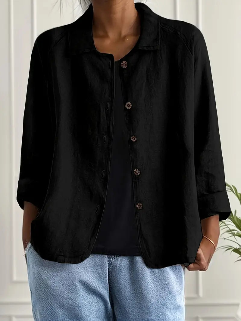 Side view of a relaxed fit women's long sleeve blouse, showcasing its elegant drape and versatile design.