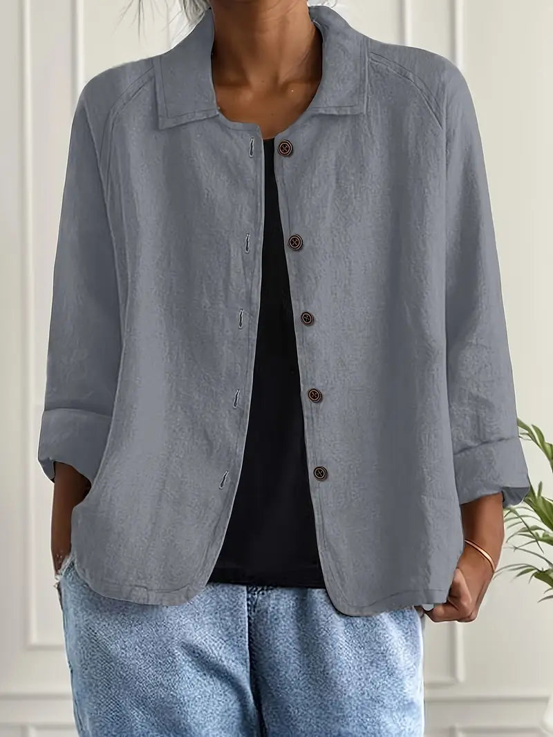 Women's button-up long sleeve shirt styled for professional office wear, an elegant and comfy top.