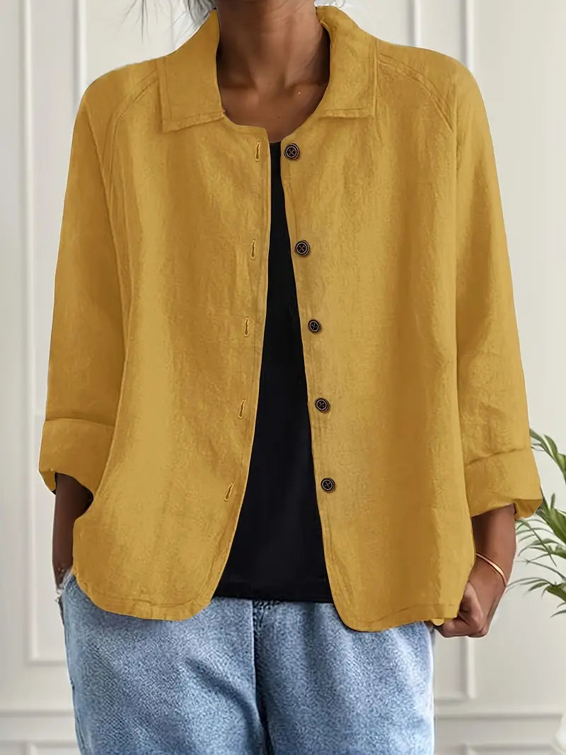 Flowy women's long sleeve button-up blouse, offering a relaxed fit and elegant silhouette for versatile wear.