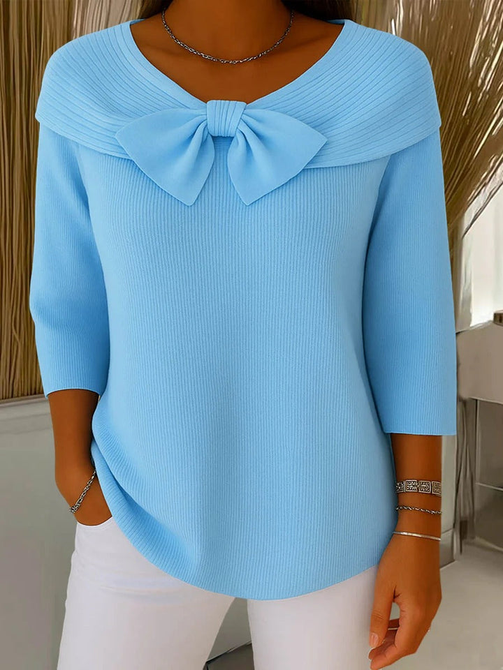 Elegant women's long sleeve sweater with chic bow detail, perfect for fall and winter fashion.