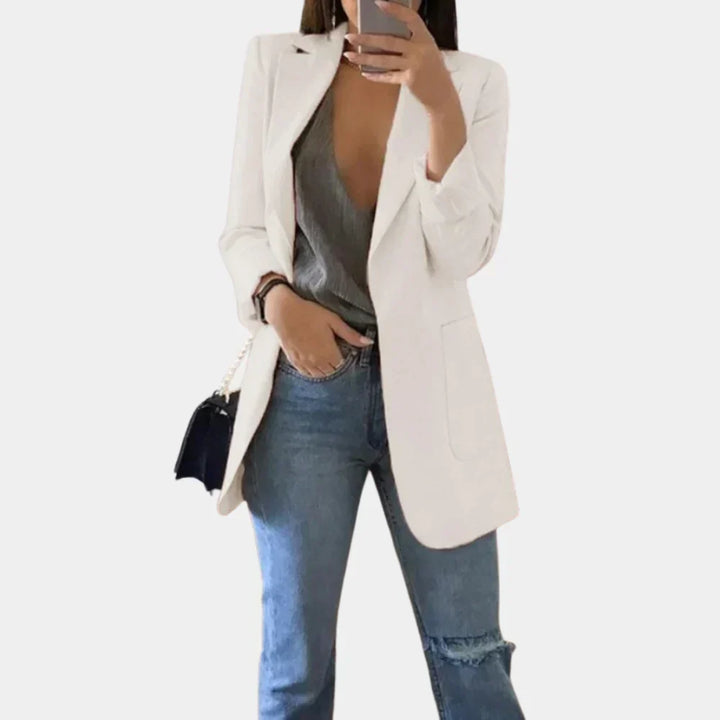 Stylish women's tailored long blazer, slim fit design for a modern professional look. Versatile ladies fashion.