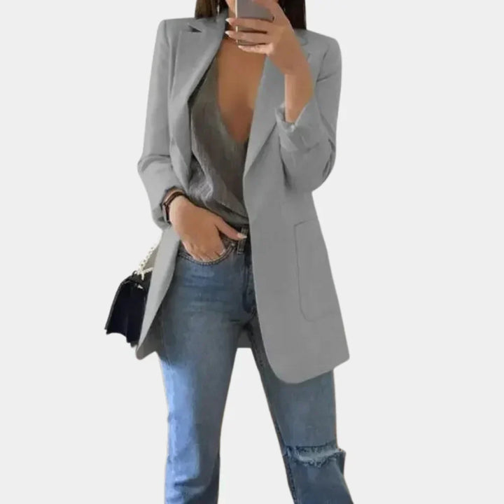 A versatile women's long slim fit blazer styled for professional office wear, enhancing any workwear ensemble.