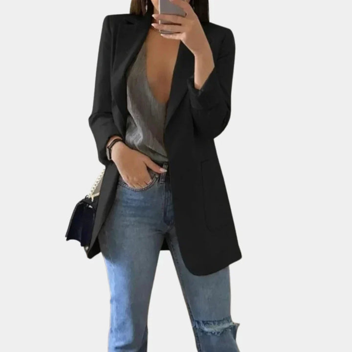 Modern women's long blazer, a slim fit tailored jacket for a sophisticated and elegant professional style.