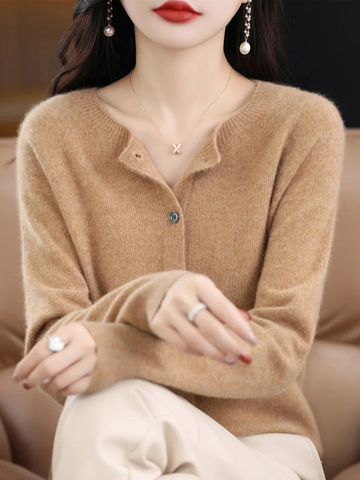 Close-up of the cuff on a women's soft merino wool O-neck sweater, showing fine knit detail