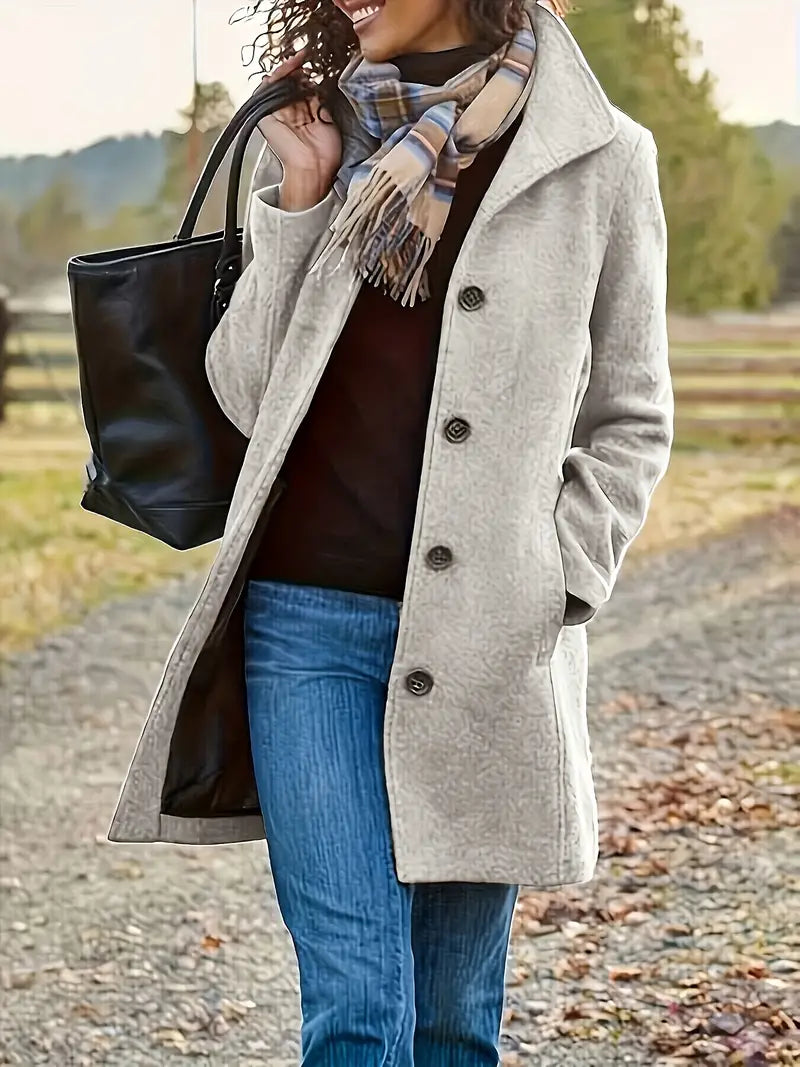 Elegant women's mid-length button-front trench coat with lapel collar, perfect for fall and winter seasonal wear.