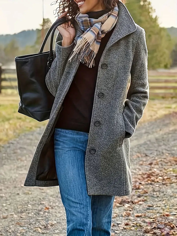 Classic women's mid-length trench coat featuring a button-front closure and lapel collar, ideal for stylish outerwear.