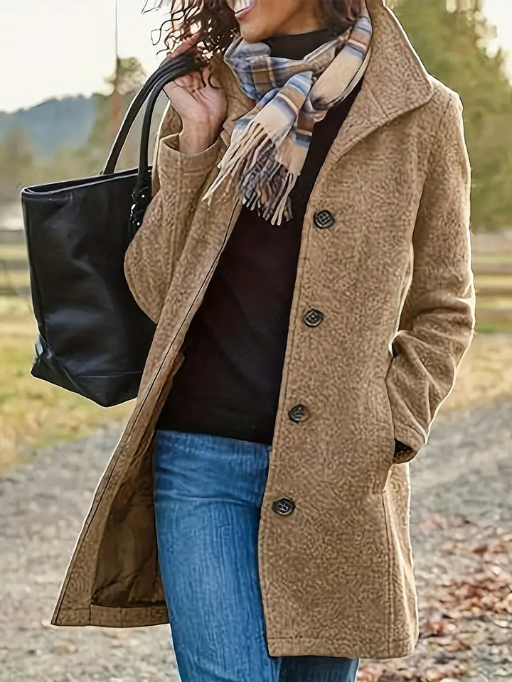 Stylish women's mid-length button coat, versatile seasonal outerwear for fall fashion & cool weather elegance.