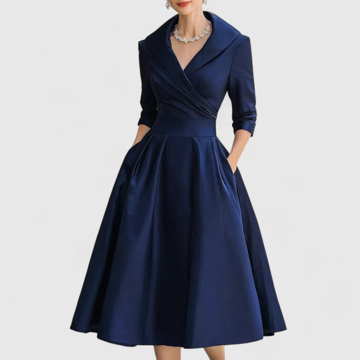 Elegant women's midi dress with flattering fit, V-neck, and 3/4 sleeves for versatile day-to-night wear.