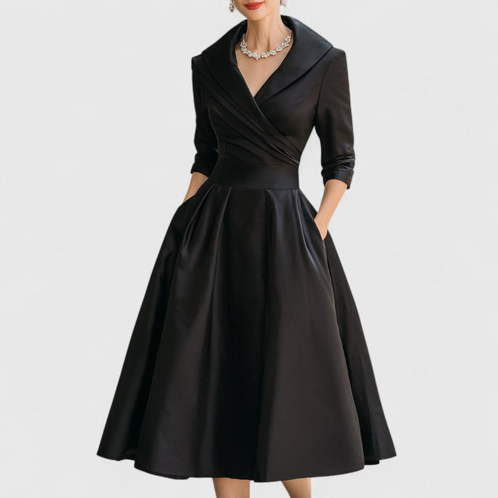 Stylish women's midi cocktail dress. Features a flattering fit, V-neck, and elegant 3/4 sleeves.