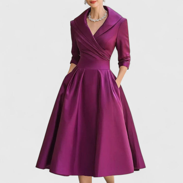 Chic women's V-neck midi dress with 3/4 sleeves. Offers a flattering, comfortable fit for any occasion.