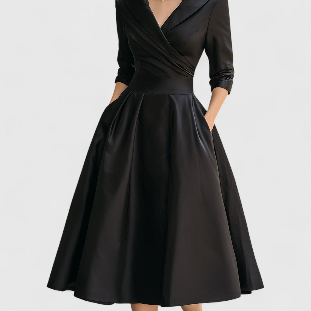 Elegant women's day-to-night midi dress with a flattering fit, V-neck, and stylish 3/4 sleeves.