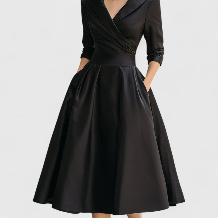 Elegant women's day-to-night midi dress with a flattering fit, V-neck, and stylish 3/4 sleeves.
