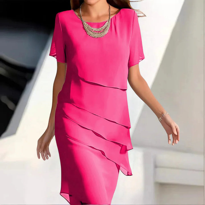 Chic women's short-sleeve midi dress. Comfortable round-neck design, perfect for elegant occasion wear.