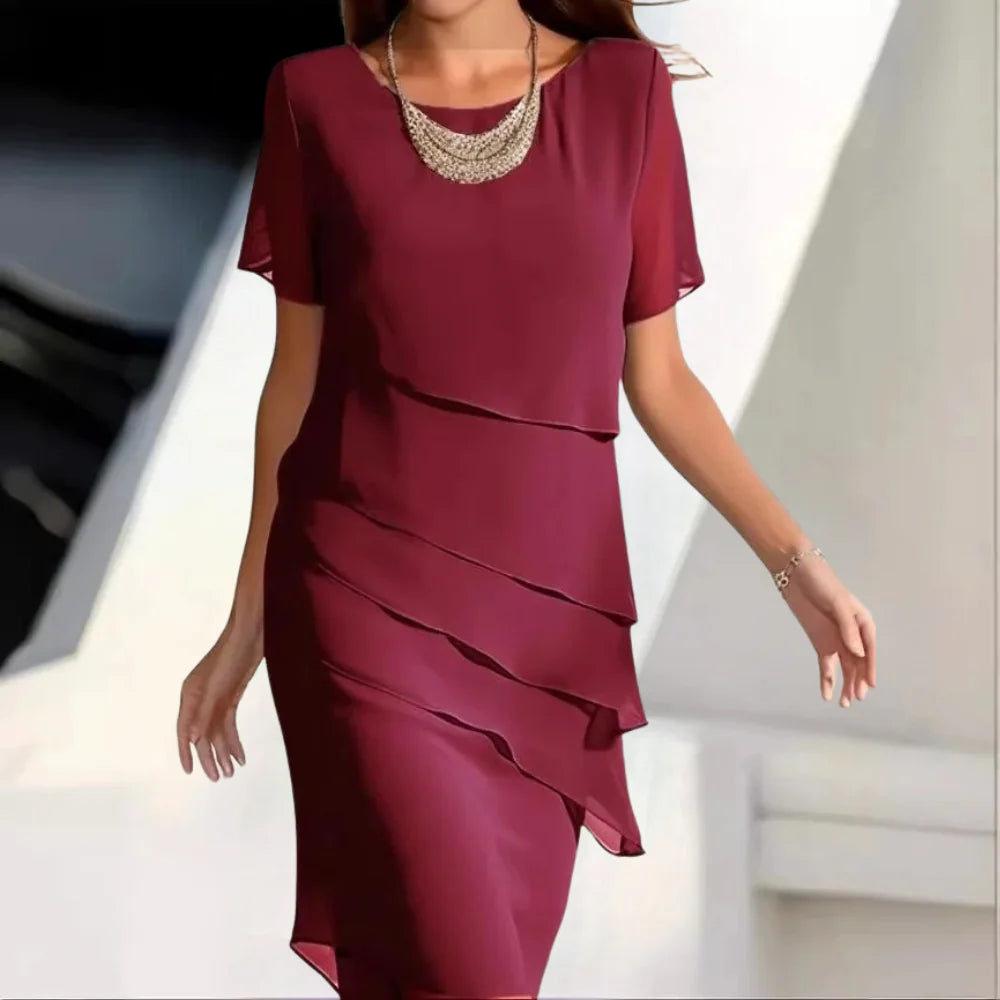 New women's elegant midi dress. Versatile round neck, short-sleeve design for comfortable summer & occasion wear.