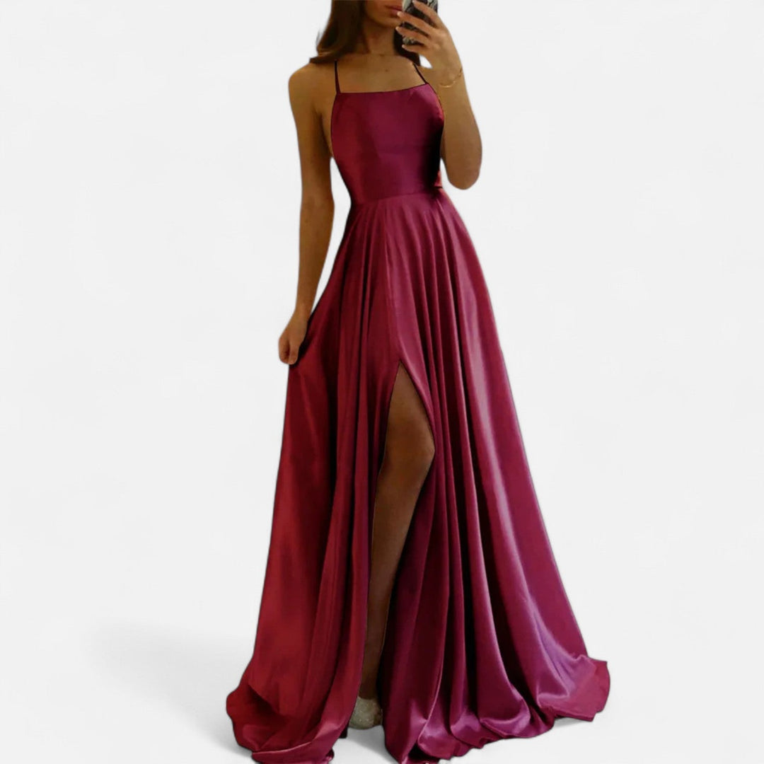 Modern women's elegant satin dress with a high slit, designed as a stunning evening gown or party dress