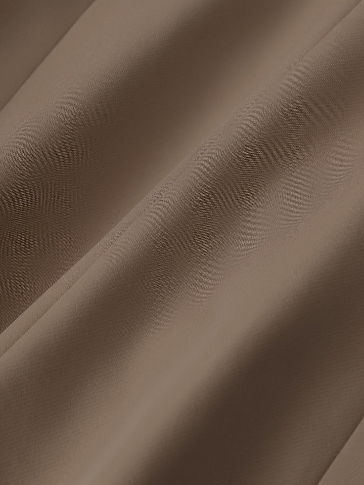 Stylish women's pant set featuring a sophisticated notched lapel blazer and tailored trousers for work.