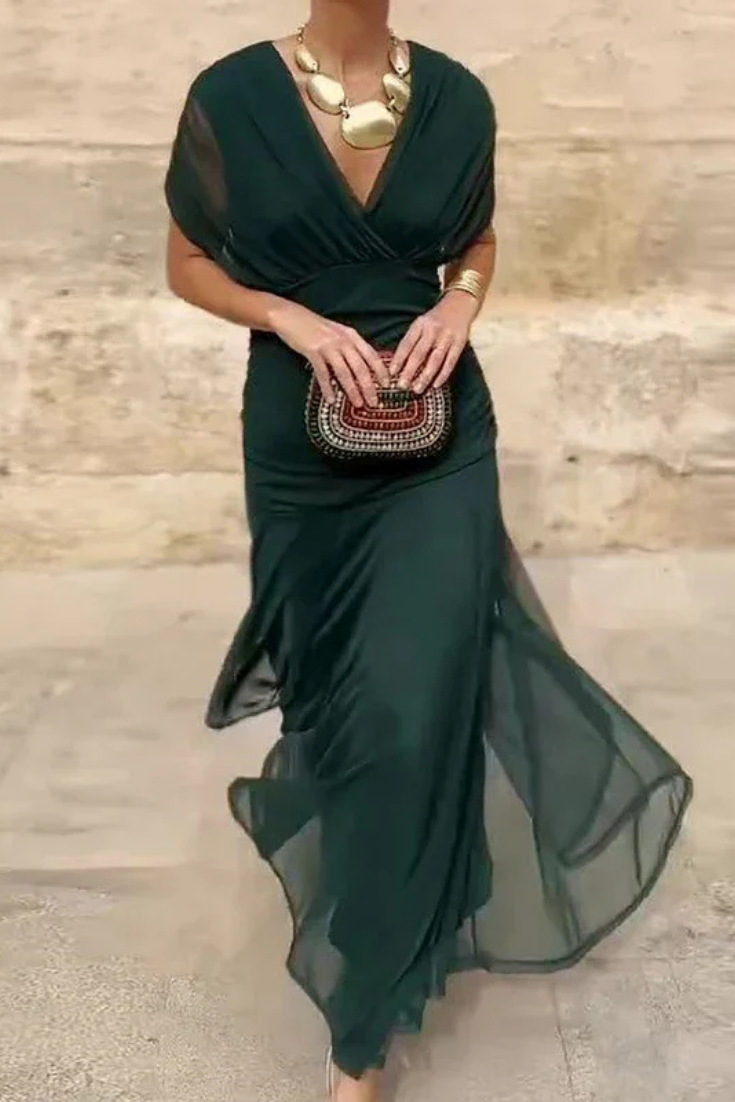 Back view of the women's off-shoulder ruched twist midi dress, showcasing its flattering silhouette.