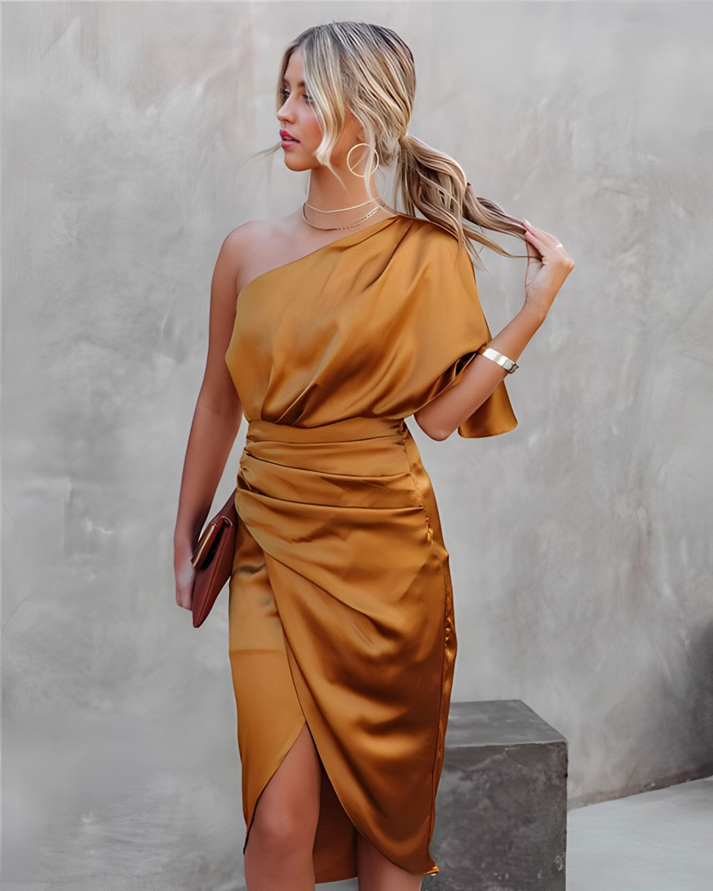 Close-up of the textured fabric of the women's satin one shoulder wrap midi dress.