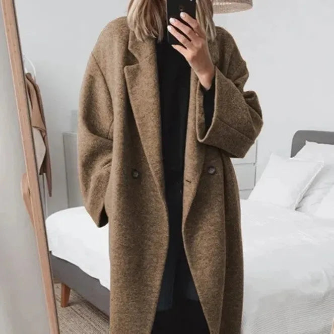 Warm women's button-down oversized coat, a chic fall jacket with a casual yet sophisticated look.