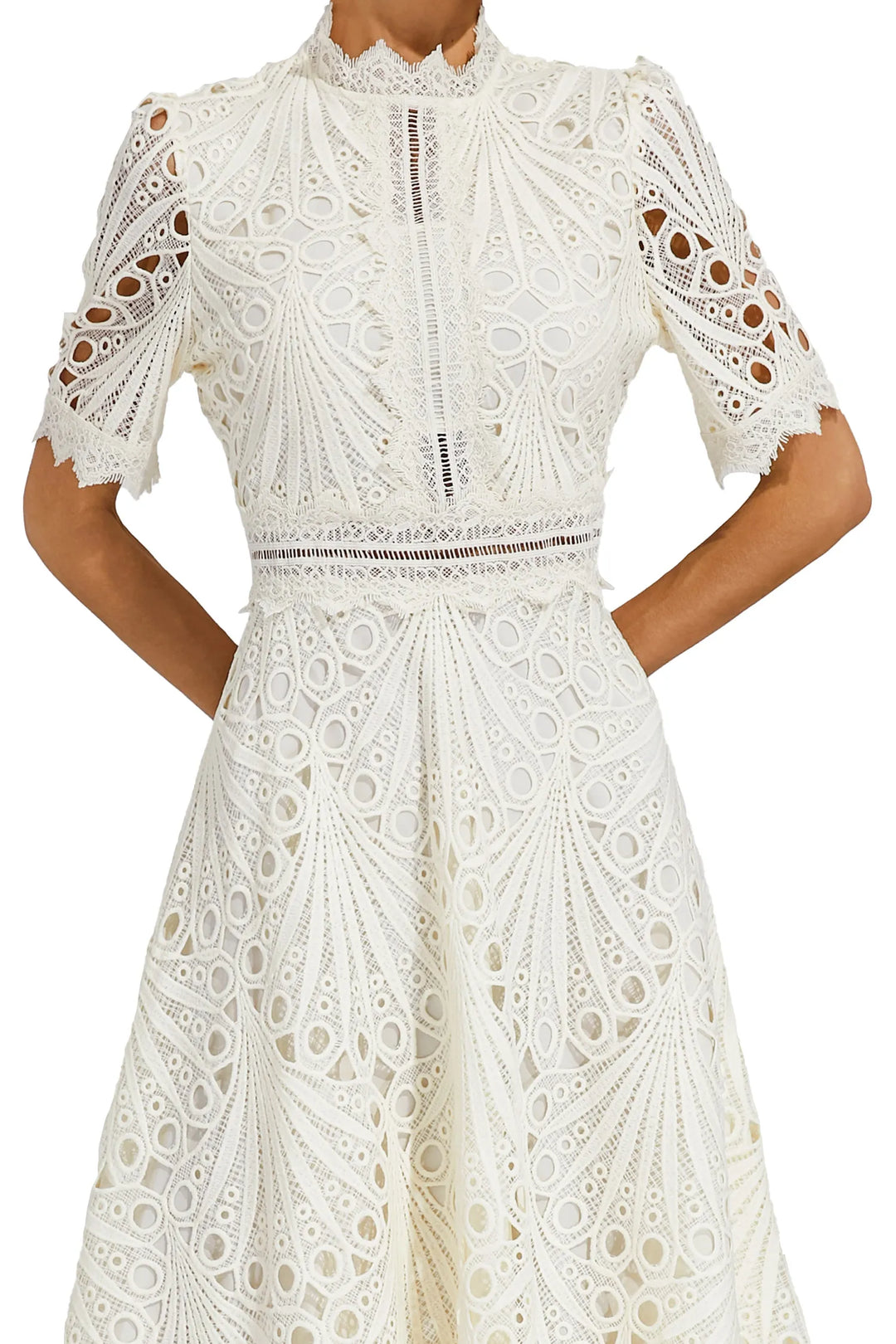 Intricate lace skirt detail of a women's pink midi dress, highlighting the quality and design