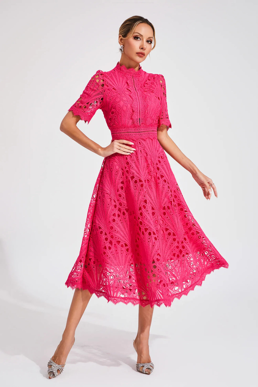 Women's pink lace midi dress with intricate detailing, suitable for evening wear, stylish design