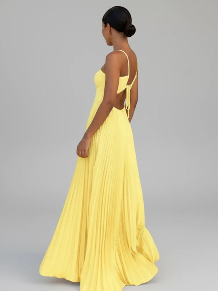 Flowy pleated A-line maxi dress for women in coffee color. Elegant backless summer dress, suitable for events.