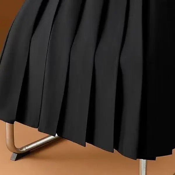 Versatile women's pleated midi skirt in A-line silhouette, offering timeless elegance and comfort.