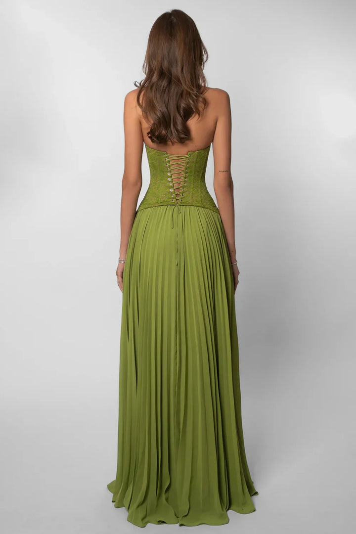 Beautiful green formal maxi dress for women: pleated fabric, halter neck, & corset-style for wedding guests.