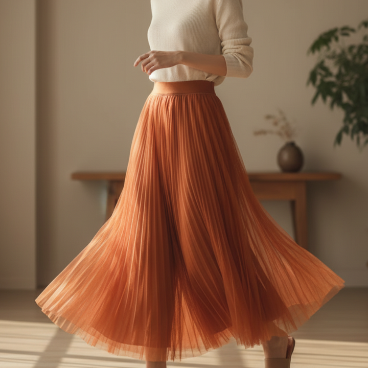 Elegant women's pleated flowy A-line midi skirt. Perfect high-waist design for chic spring/summer fashion.