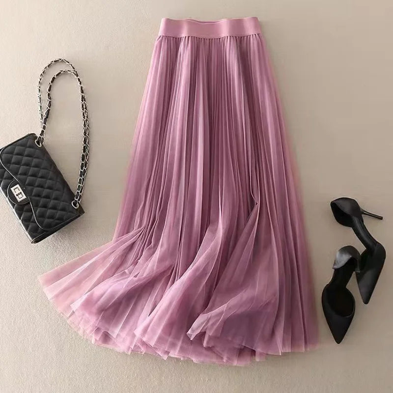 Versatile women's pleated flowy A-line midi skirt. High-waist for an elegant summer look, ideal for many occasions.