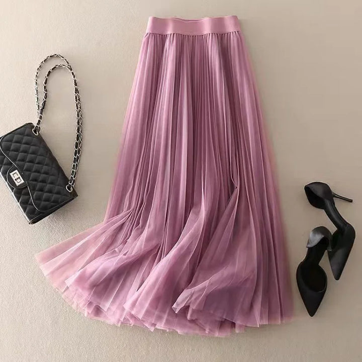Versatile women's pleated flowy A-line midi skirt. High-waist for an elegant summer look, ideal for many occasions.