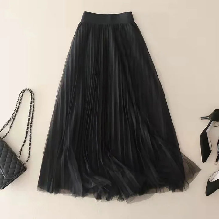 Detail shot of elegant women's pleated flowy A-line midi skirt, highlighting the versatile and chic design.