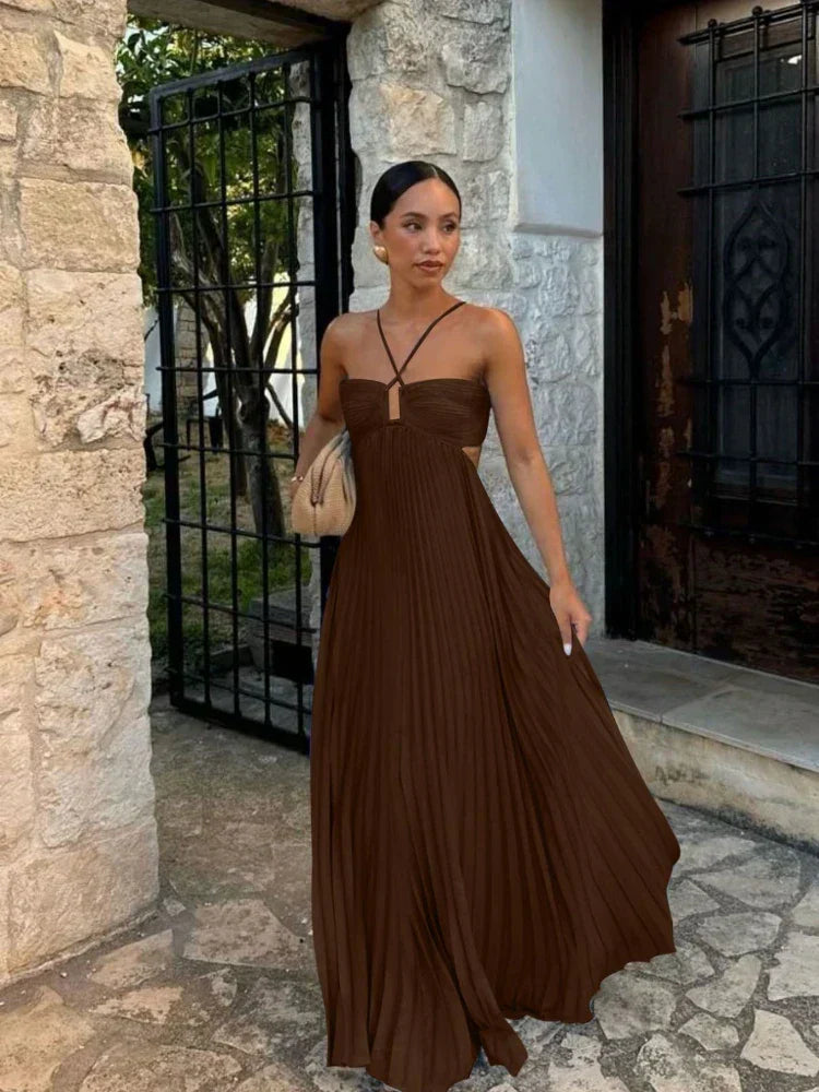 Elegant women's pleated halter maxi dress, perfect for wedding guests and formal occasions. Sleeveless, long design.
