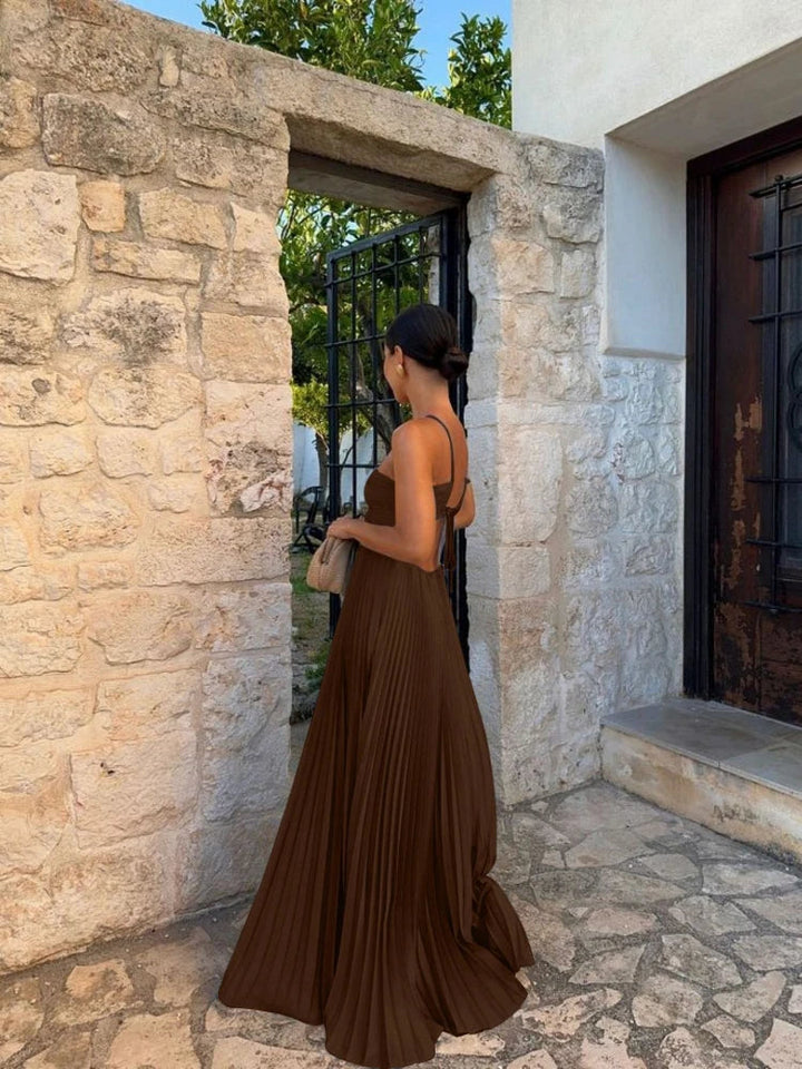 Women's elegant pleated halter maxi dress, suitable for wedding guests, parties, and formal events. Long & stylish.