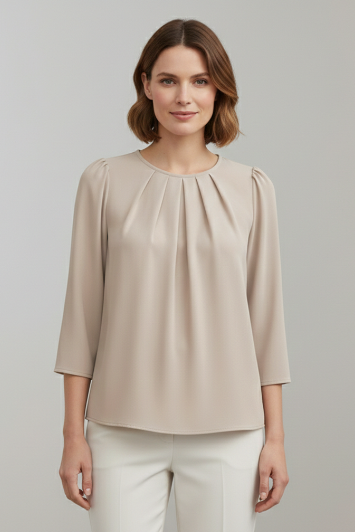 Sophisticated women's pullover blouse with pleats and long sleeves. Versatile fashion top.