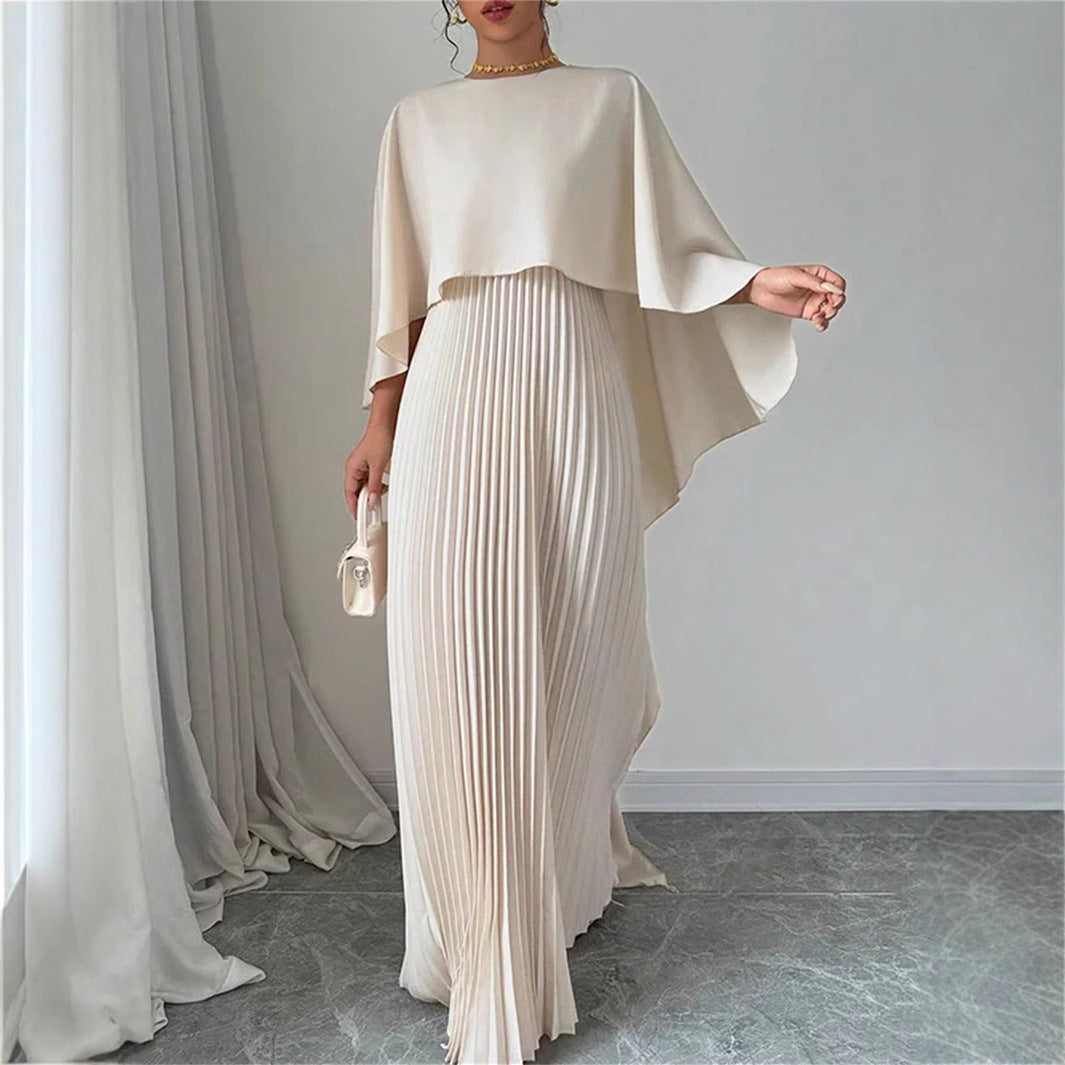 Elegant women's pleated maxi dress with chic cape overlay, perfect for evening wear or formal occasions.