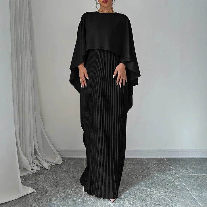Stylish women's pleated maxi dress with elegant cape overlay. Versatile for evening wear or special events.